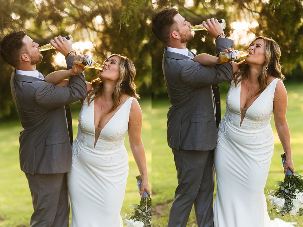 Newlyweds sharing a beer in a park at sunset by Hannah Louise Photography