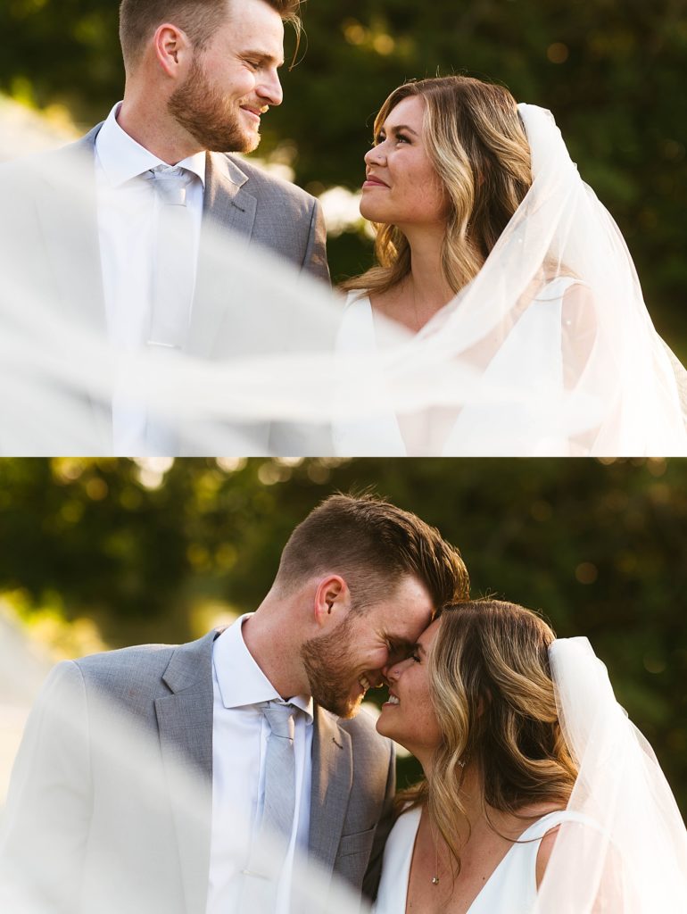 Bride and groom smiling at each other fondly during golden hour portraits