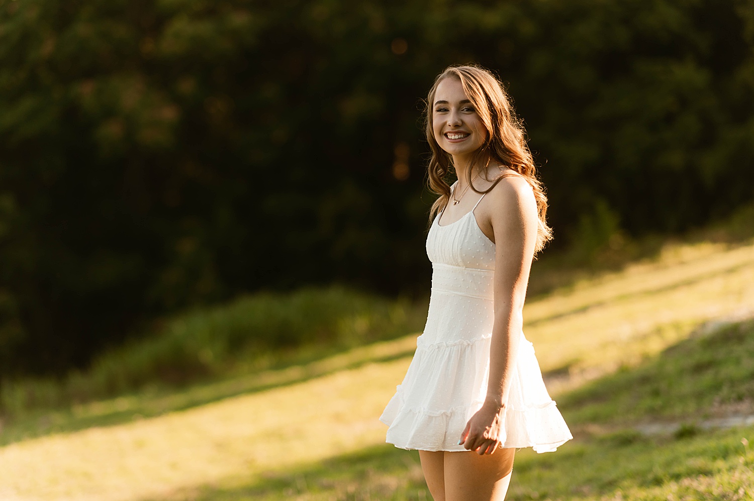 Brunette in white dress at a park for for Golden Hour Session
