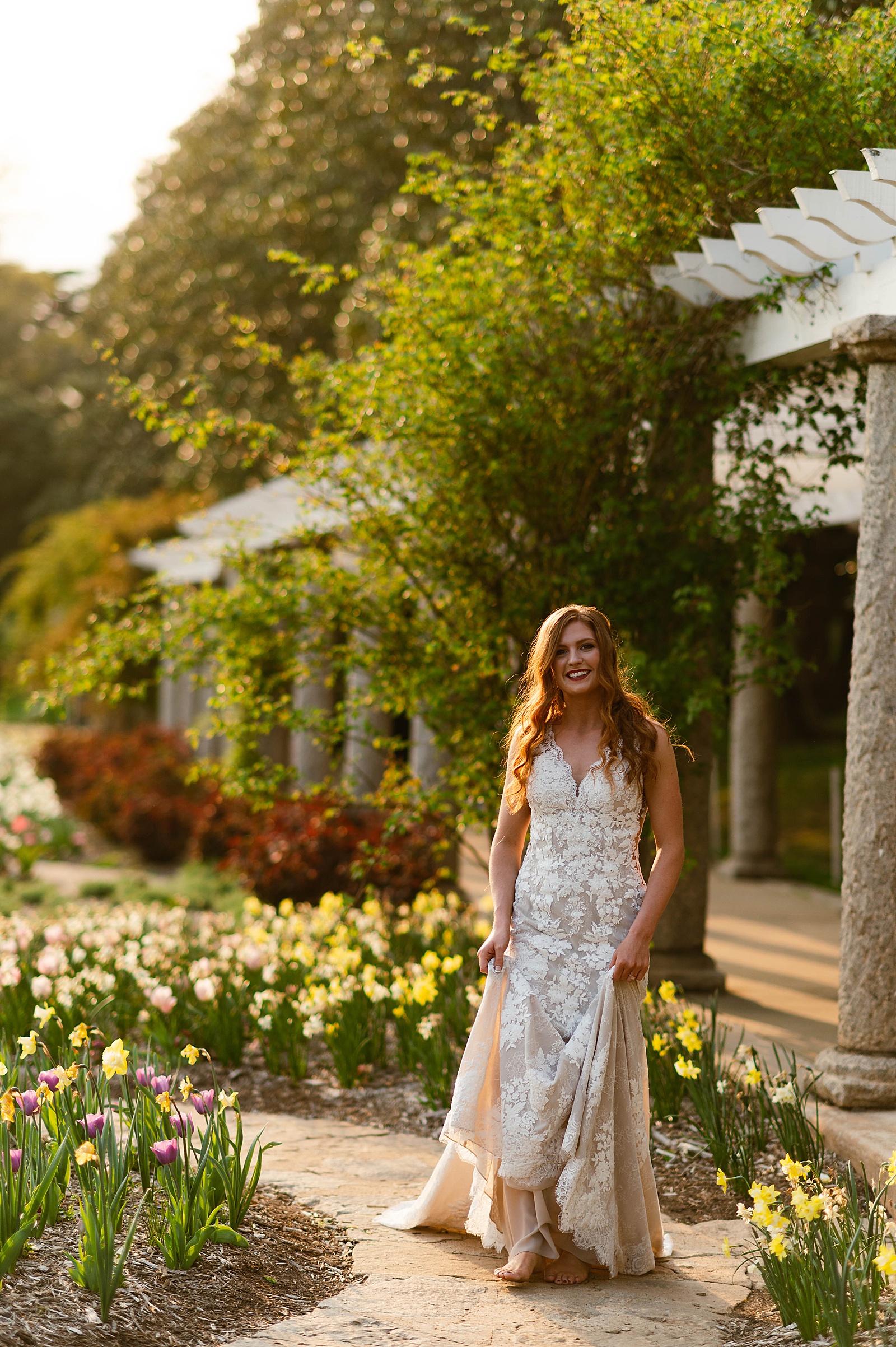 Woman in lace gown dancing in tulips by Richmond Elopement Photographer