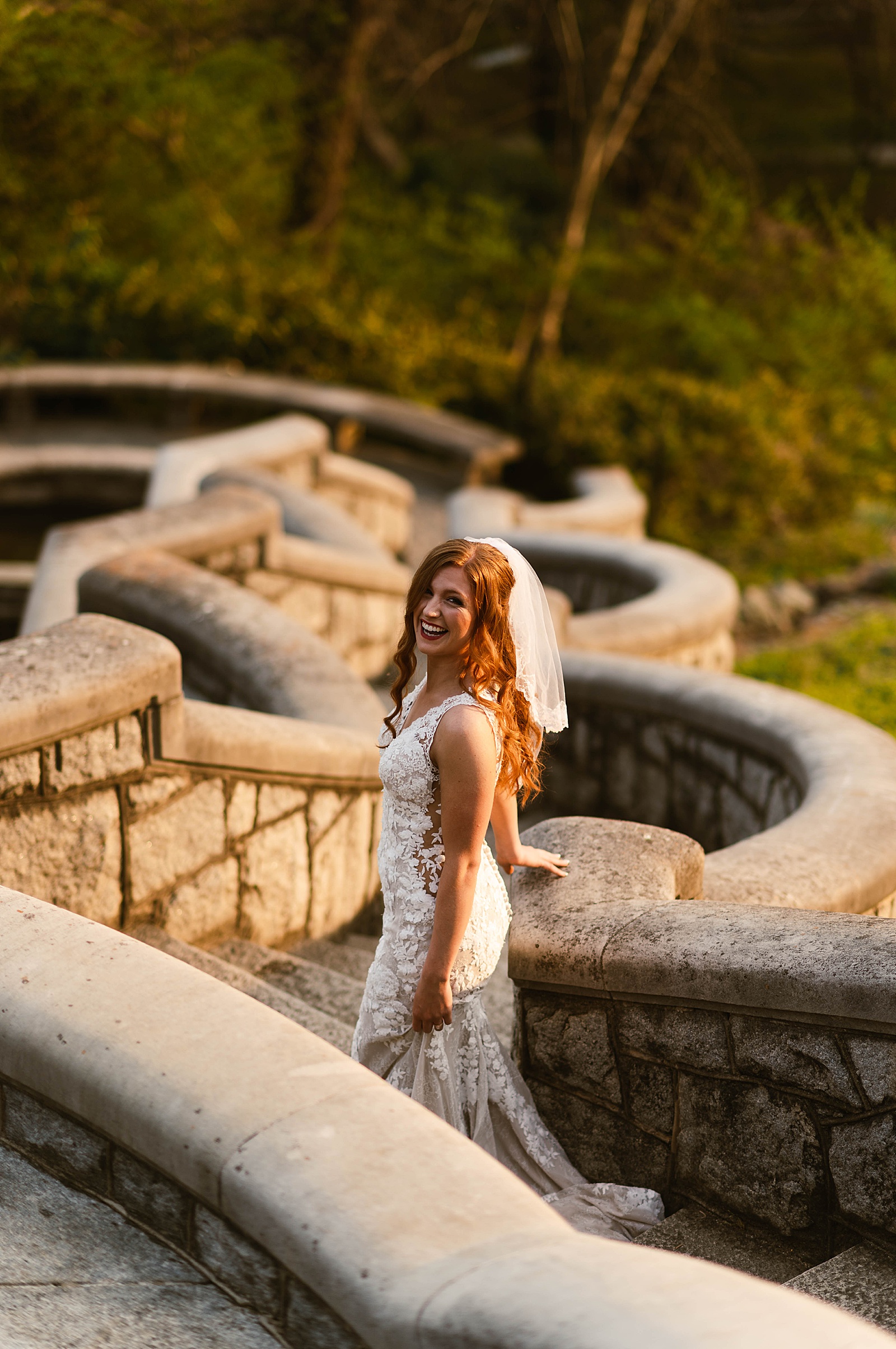 Bride with red hair walking down stone steps by Richmond Elopement Photographer