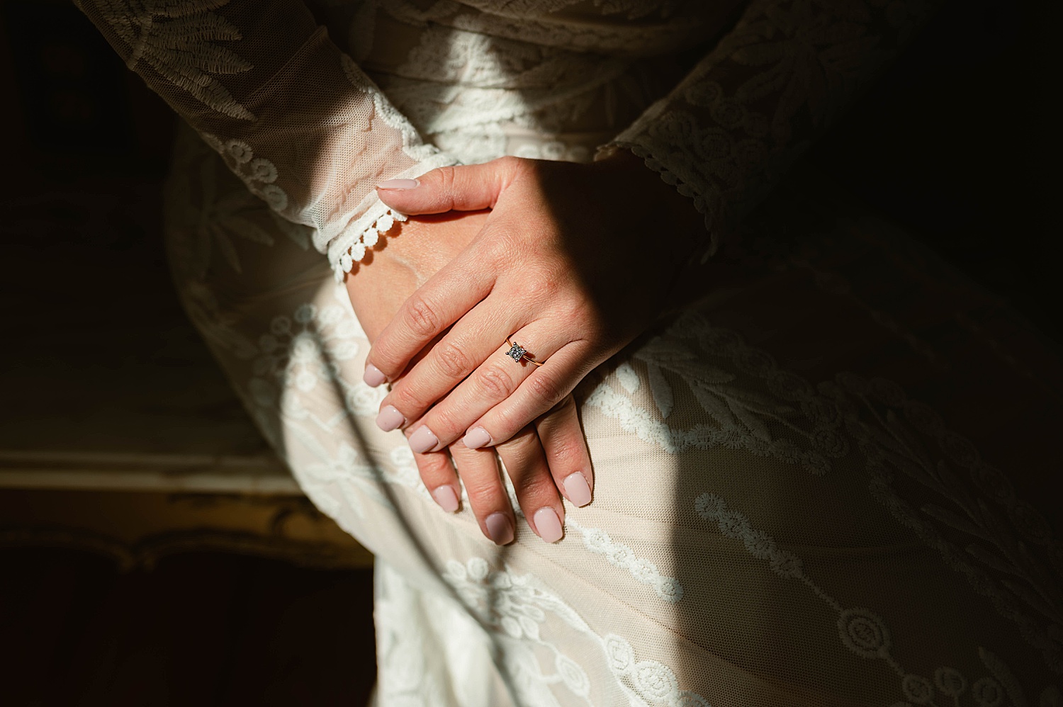 Bride showing ring under window light by Virginia Wedding Photographer 