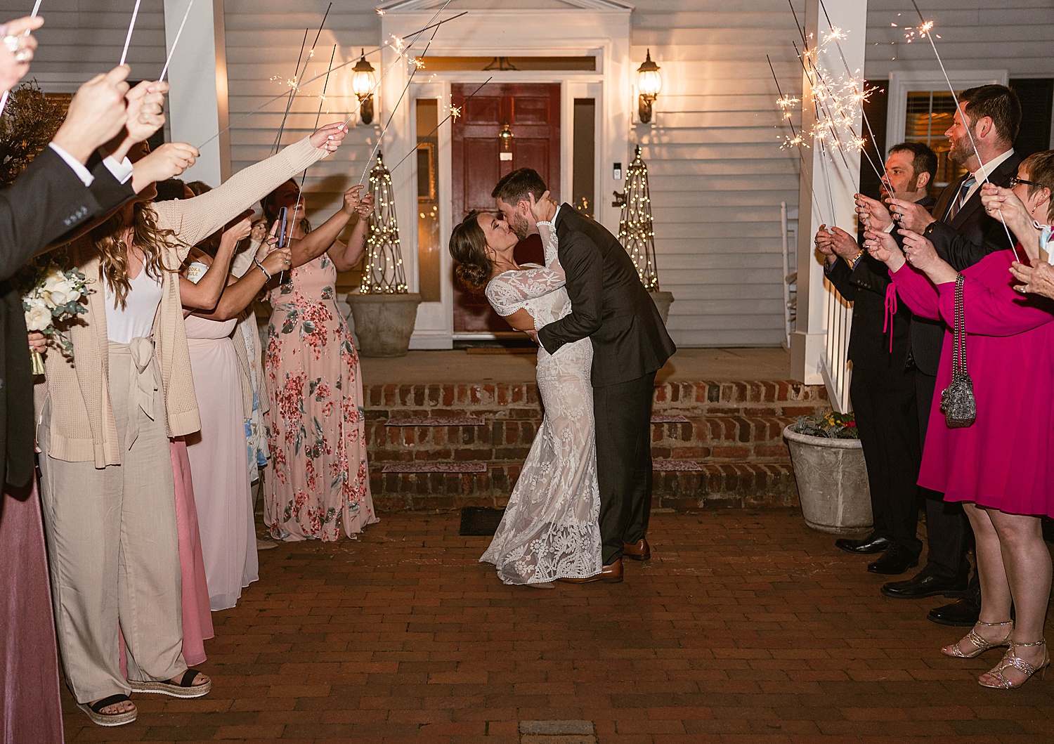 Bride and groom kissing during sparkler exit by Virginia Wedding Photographer 