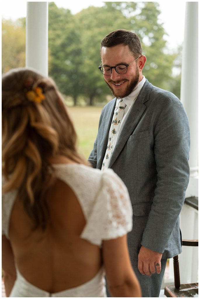Bride and groom during first look by by Hannah Louise Photography
