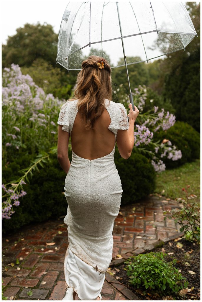 bride walking in the rain by Virginia photographer