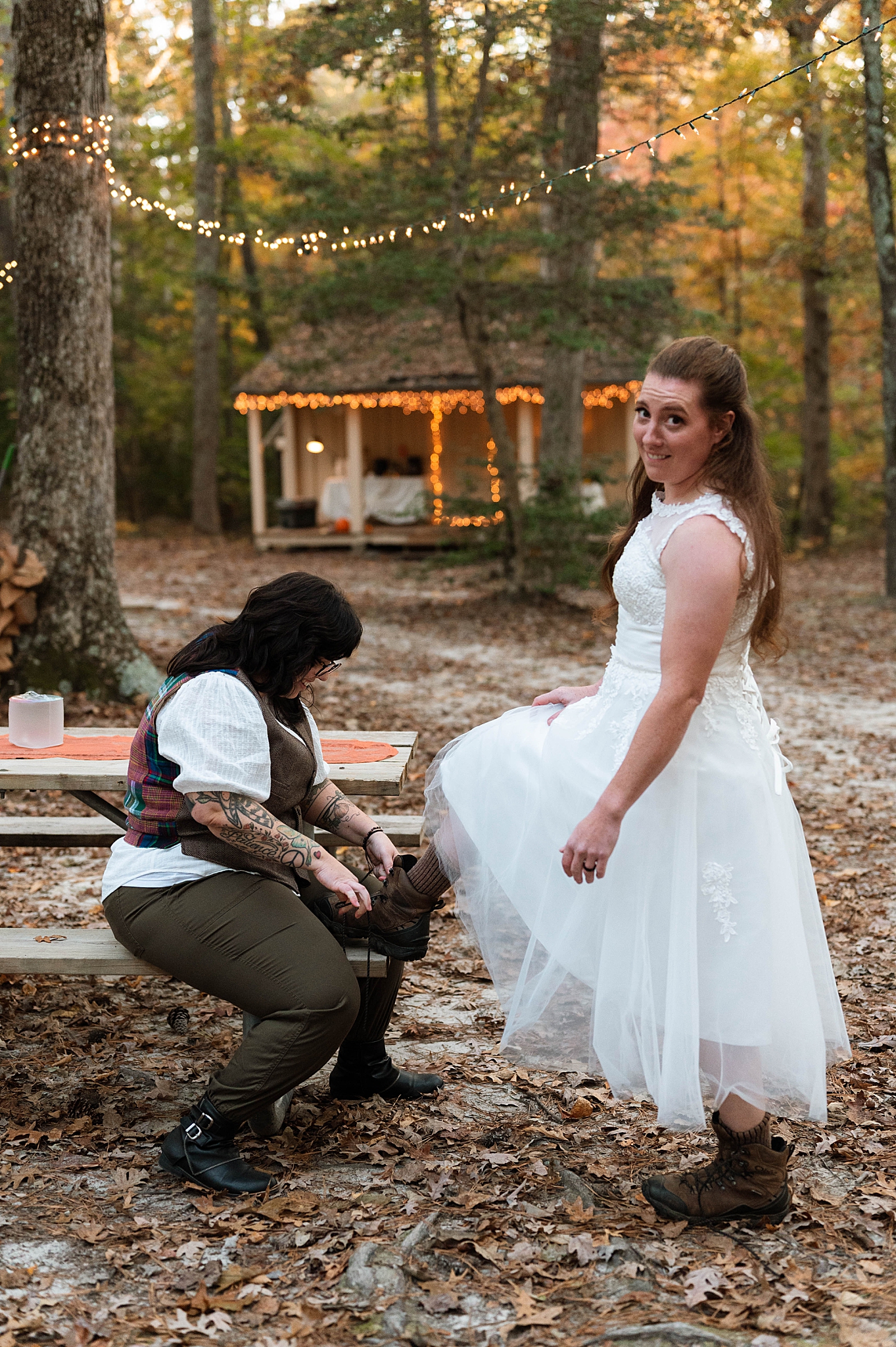 wife ties wife's shoe at vow renewal