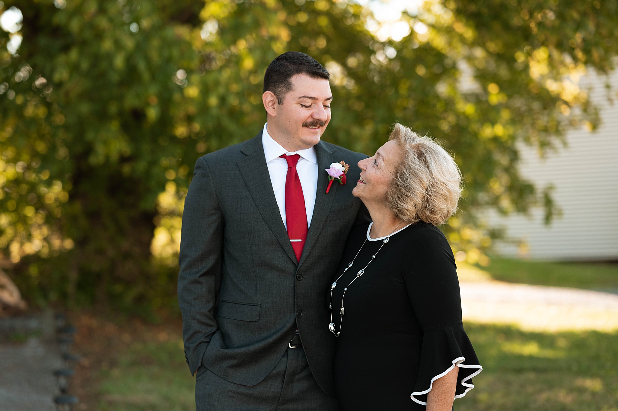 mother and son smile at each other by Virginia Photographer